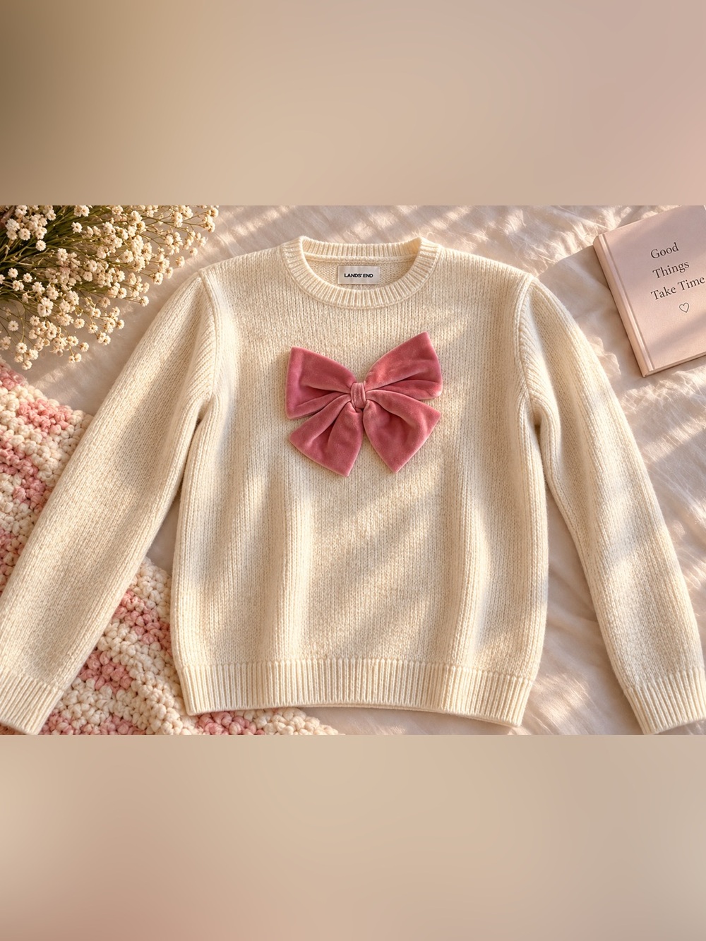 Lands' End cream sweater with pink velvet bow accent